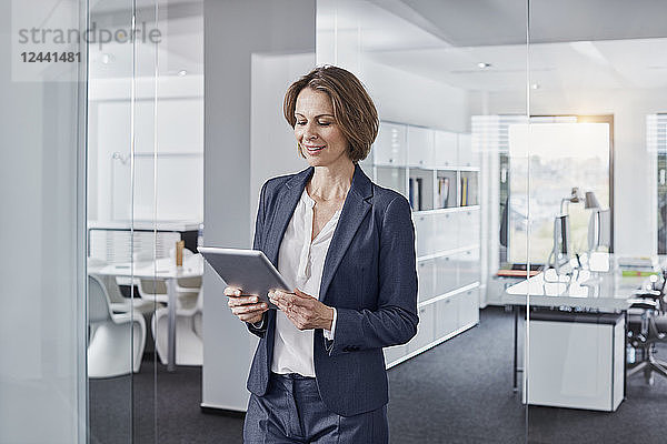 Businesswoman using tablet in office