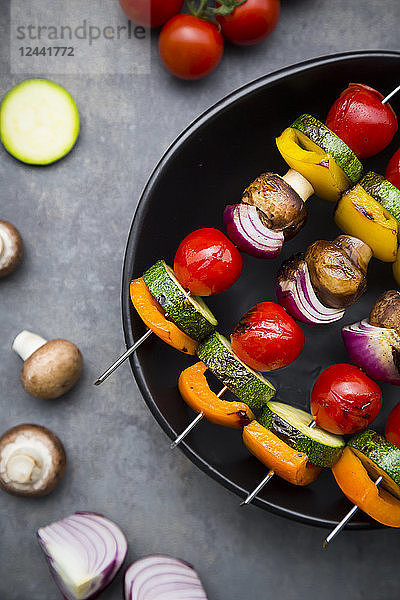 Vegetarian grill skewers on bowl