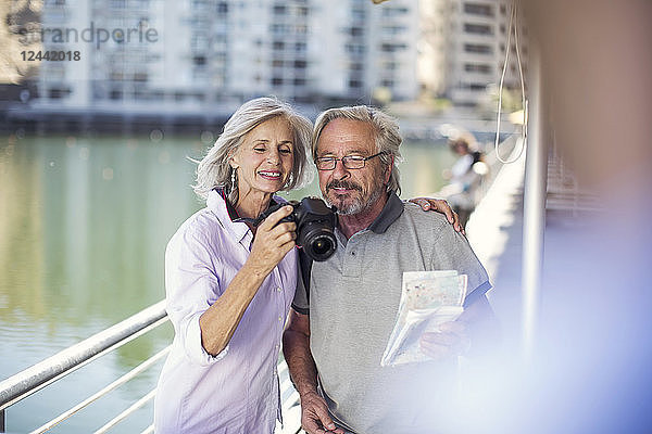 Senior couple taking a city break  taking photos