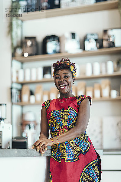 Portrait of happy woman in a coffee bar