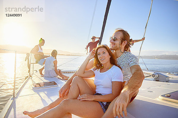 Couple relaxing on sunny boat