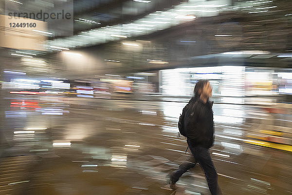 Man walking on urban street at night