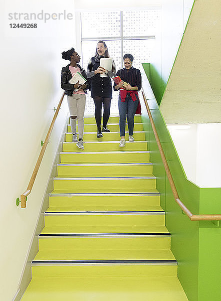 High school girls descending stairs