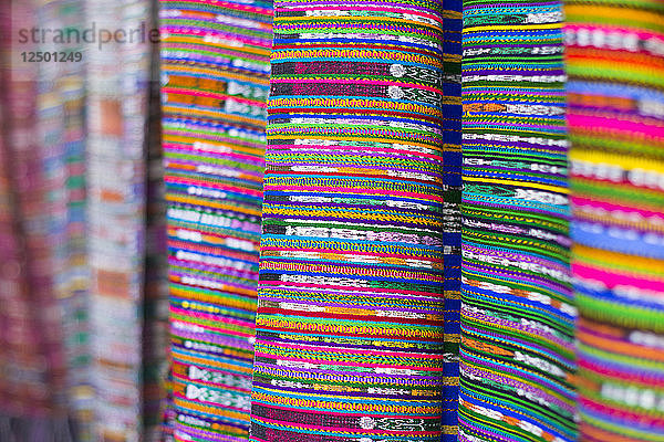 Multi Colored Handmade Tzutes Or Work Clothes Hanging At The Chichicastenango Market
