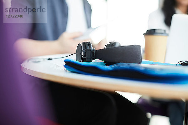 Close-up of headphones on table in cafeteria