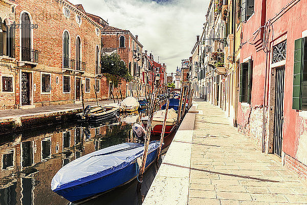 Italy  Venice  alley and boats at canal