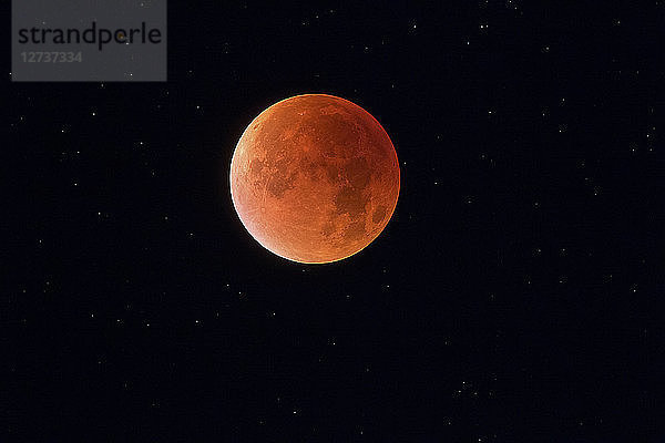 Total lunar eclipse with stars in background  blood moon