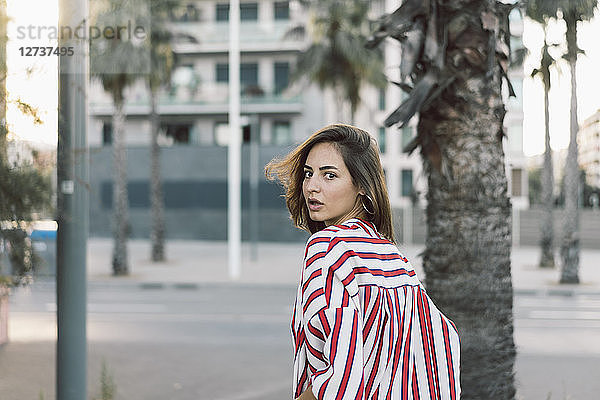 Portrait of woman wearing striped shirt