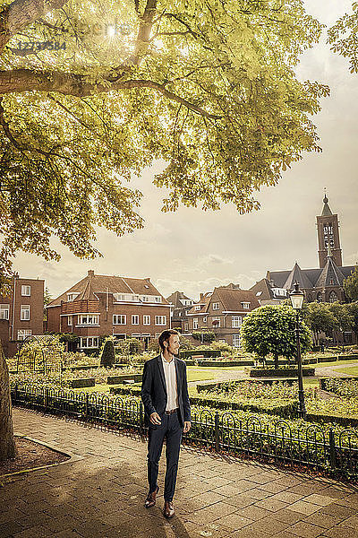 Netherlands  Venlo  businessman standing on pavement