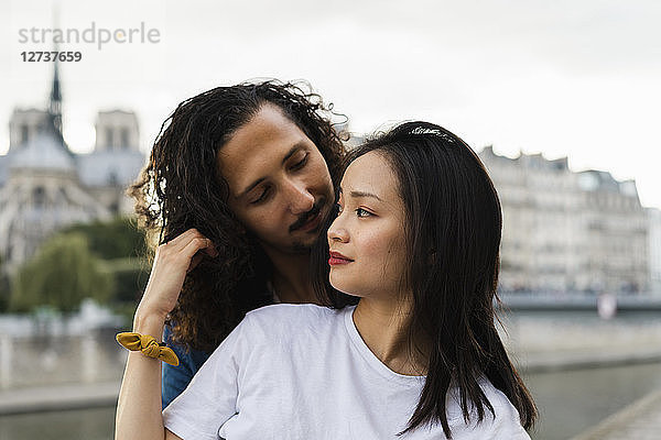 France  Paris  young couple in love at river Seine