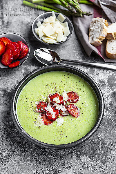 Green asparagus cream soup with strawberry  parmesan and baguette
