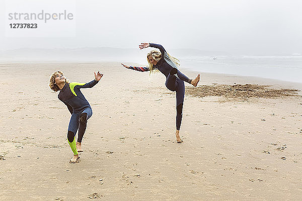 Spain  Aviles  two young surfers warming up before surfing