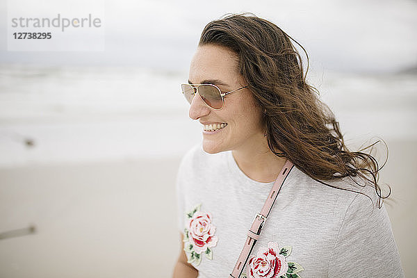 Portrait of happy woman on the beach