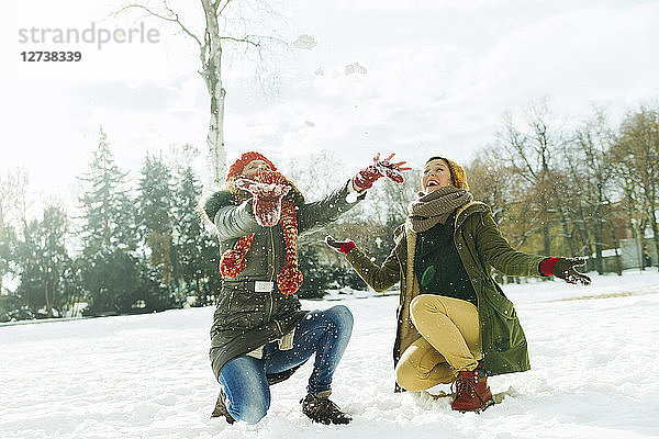 Two best friends having fun in the snow