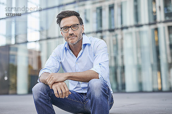Portrait of relaxed businessman outdoors