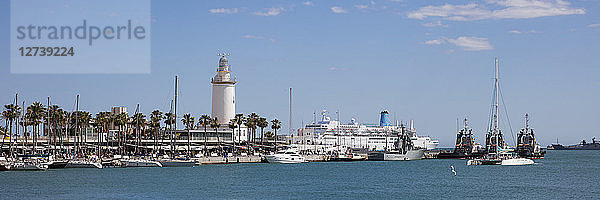 Spain  Andalusia  Malaga  Panoramic view of harbour  lighthouse La Farola de Malaga