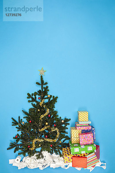 Christmas tree and pile of Christmas presents
