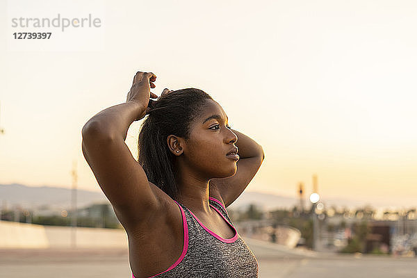 Portrait of young woman during work out