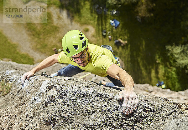 Austria  Innsbruck  Hoettingen quarry  man climbing in rock wall