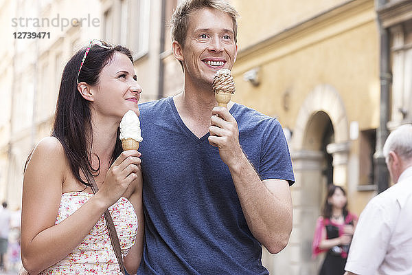 Poland  Warsaw  Young couple with ice cream cones