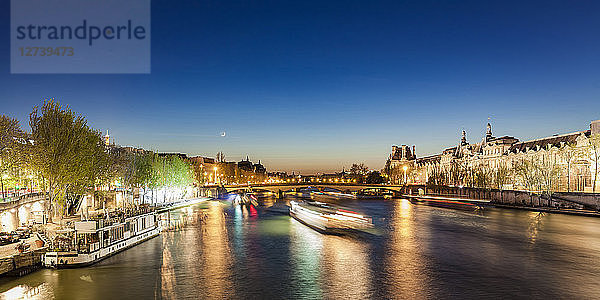 France  Paris  Pont du Carrousel with tourist boats at night