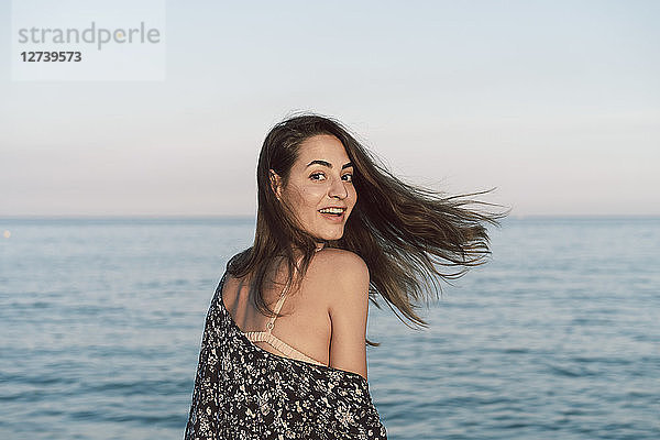 Beautiful woman on the beach  smiling  portrait