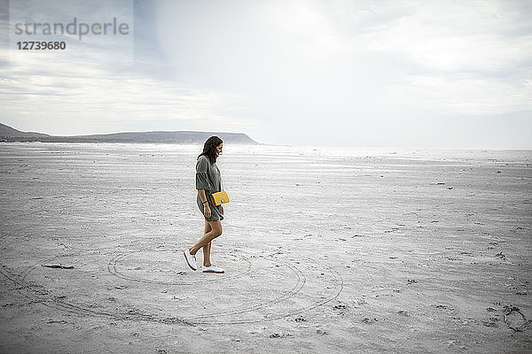 South Africa  Western Cape  Noordhoek  woman walking on the beach