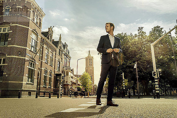 Netherlands  Venlo  businessman standing on a street
