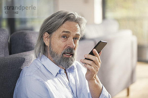 Senior man using smartphone