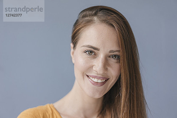 Portrait of a pretty woman  smiling  looking at camera