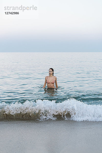 Beautiful woman at the beach  swimming in the sea