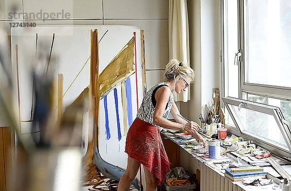 Female painter in her atelier