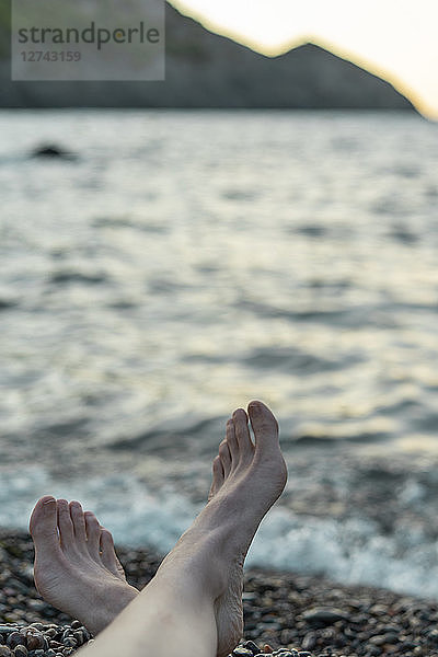 Spain  Catalonia  Costa Brava  barefoot at the beach