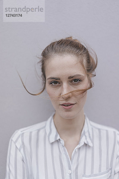 Portrait of a pretty woman with windswept hair