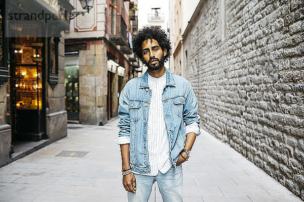 Spain  Barcelona  portrait of bearded young man with curly hair
