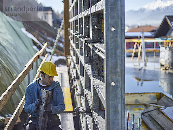 Construction worker working on plywood