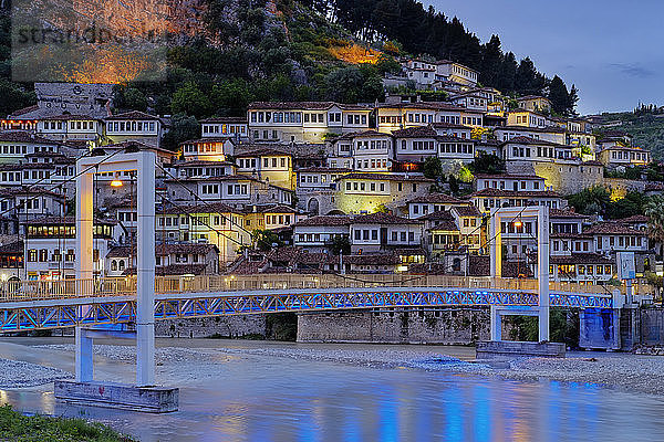 Albania  Berat County  Berat  Mangalem  Ottoman houses and castle rock at blue hour  bridge over Osum river