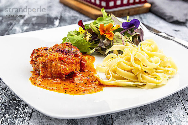 Tuscan pork fillet with tagliatelle and salad
