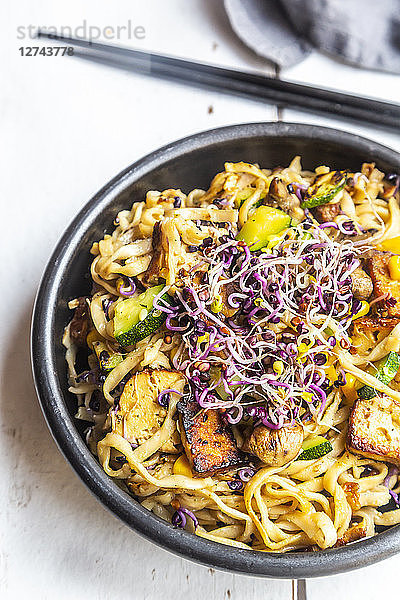 Mie noodles with tofu  zucchini  maize and red sprouts