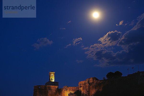 Albania  Gjirokaster  Clock tower of fortress and full moon at night