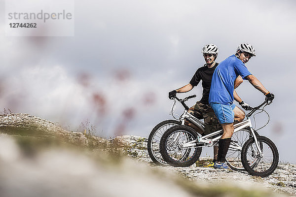 Acrobatic bikers on trial bikes