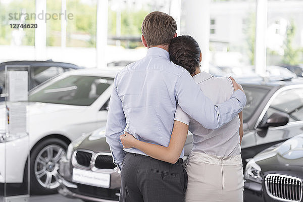 At the car dealer  Couple in showroom