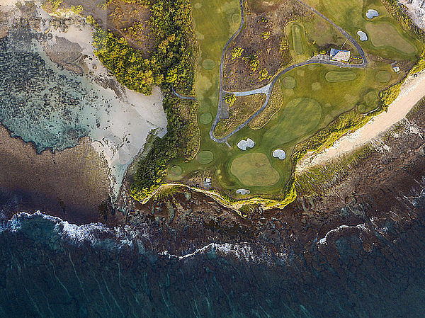 Indonesia  Bali  Aerial view of golf course with bunker and green at coast