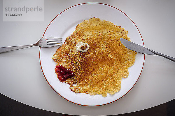 Pancake as face on plate  overhead view