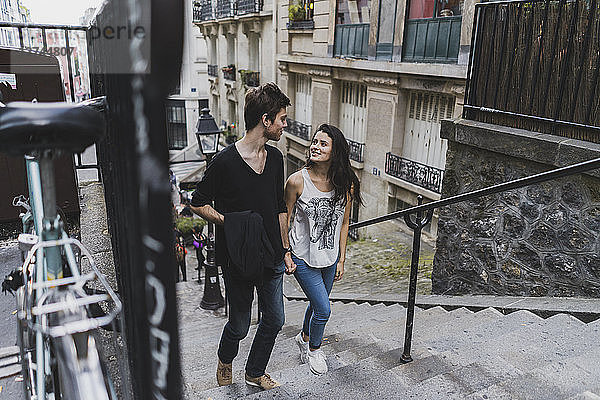 France  Paris  young couple walking in the district Montmartre
