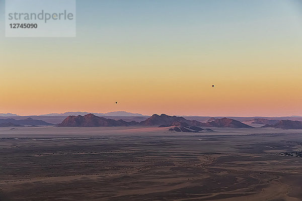 Africa  Namibia  Namib desert  Namib-Naukluft National Park  Aerial view of desert dunes in the morning light  air ballons