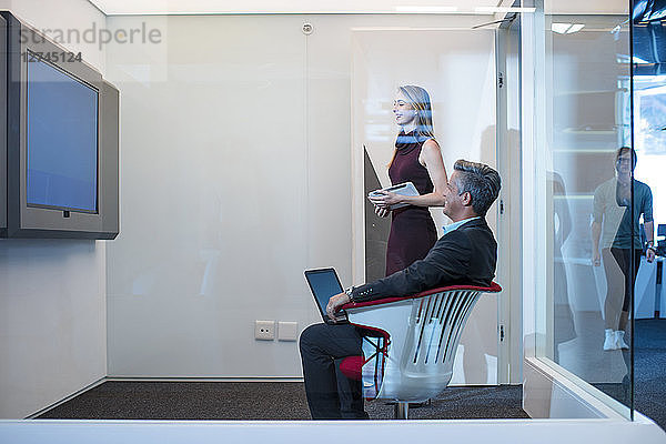 Business people having a video conference in office