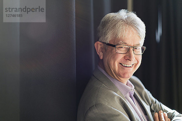 Portrait smiling  confident active senior businessman