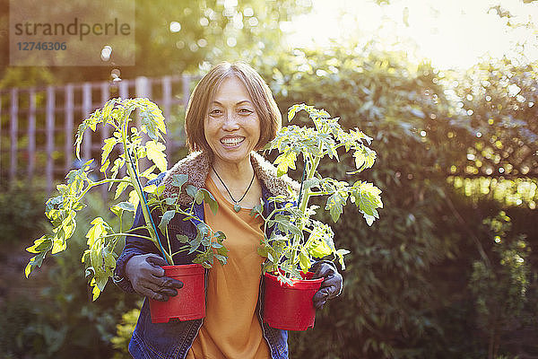 Portrait smiling  confident active senior woman gardening