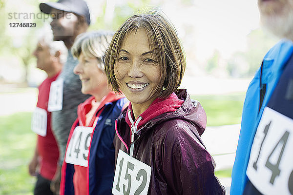 Portrait smiling  confident active senior woman at sports race starting line